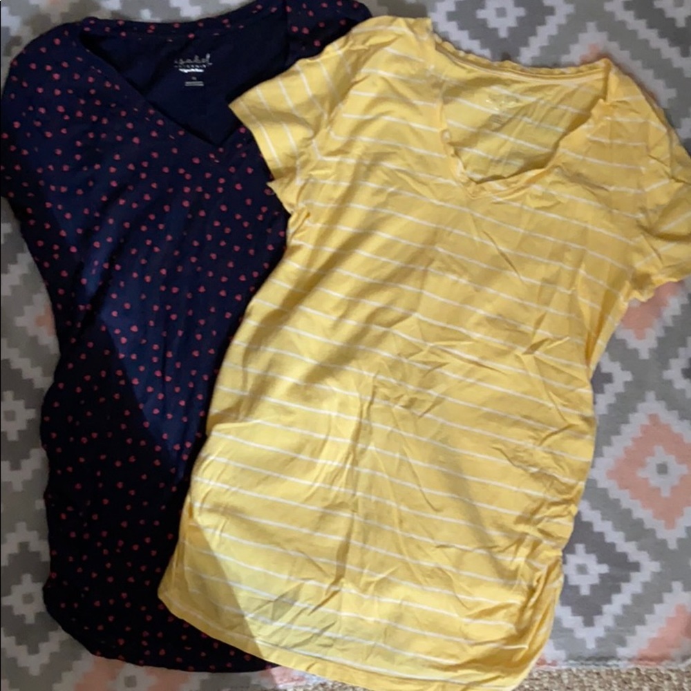 Two short sleeve tops. Size Medium.
